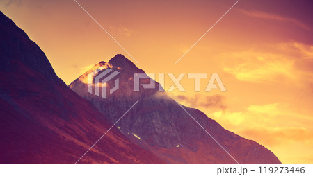 Dramatic evening cloudy sky over mountains peaks. Sunset over the mountains 119273446