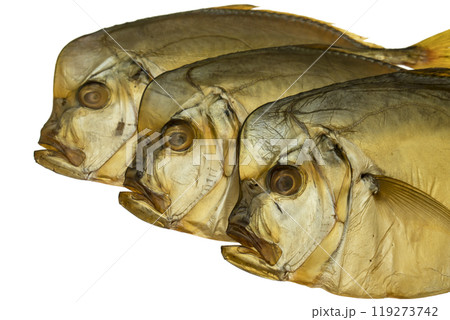 Three smoked vomer fish on a white plate isolated 119273742