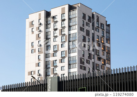 Modern high-rise apartment buildings in a residential area showcasing urban living and availability 119274080