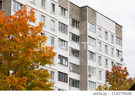 Modern high-rise apartment buildings with vibrant fall foliage in a residential area highlighting Modern high-rise apartment buildings with vibrant fall foliage in a residential area highlighting 119274086