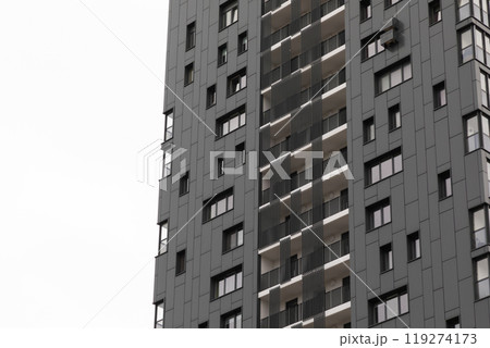 Modern high-rise apartment buildings in a residential area showcasing urban living options and Modern high-rise apartment buildings in a residential area showcasing urban living options and 119274173