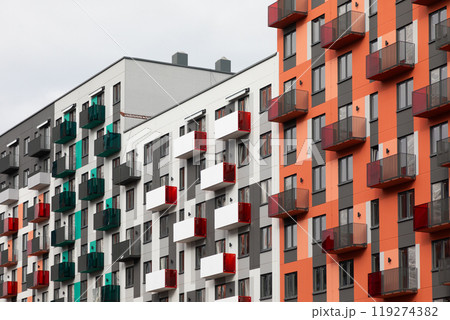 High-rise apartment buildings in a residential area showcasing diverse architectural styles and 119274382