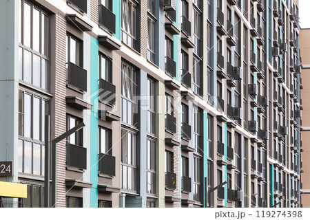 Modern high-rise apartment buildings in a bustling residential area with balconies and urban 119274398