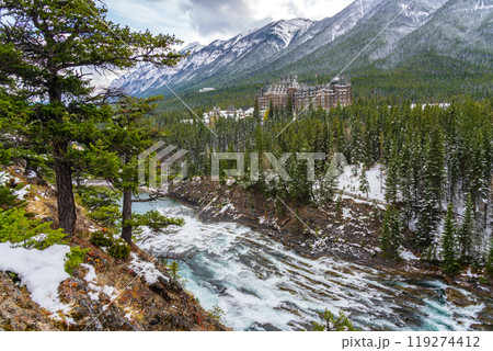 Fairmont Banff Springs and Bow River Falls in snowy autumn sunny day. View from Surprise Corner Viewpoint. Banff National Park, Canadian Rockies. 119274412