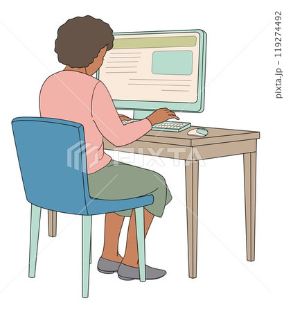 African American girl sits in a chair at a table working on a computer 119274492
