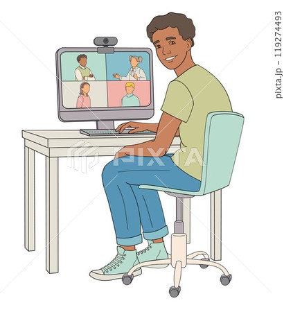 African American boy sits in a chair at a table working on a computer videoconferencing African American boy sits in a chair at a table working on a computer videoconferencing 119274493