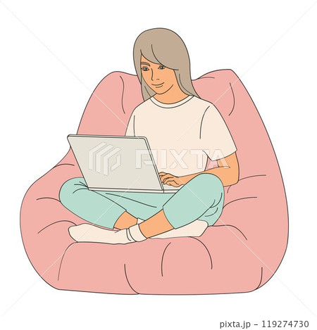 girl sitting in a chair with a laptop on her lap 119274730
