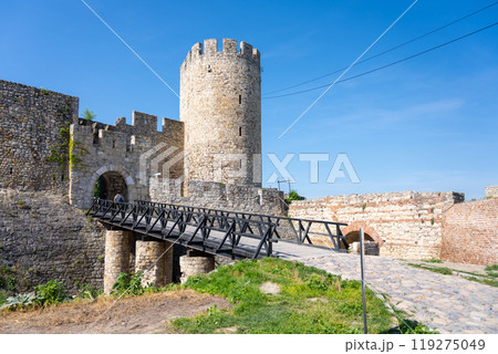 Despots Gate spans a wooden bridge leading to the historic Dizdar Tower within Belgrade Fortress, showcasing medieval architecture in the heart of Serbia's capital on a sunny day. 119275049
