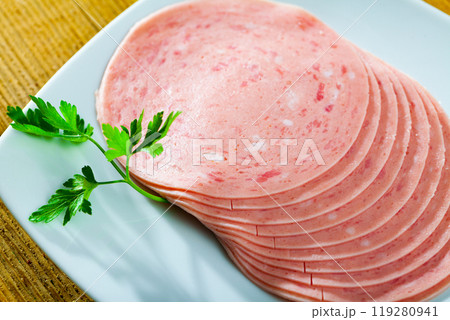 Sliced ham on wooden background 119280941