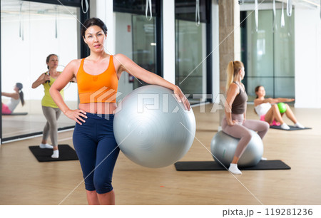 Woman with fitness ball 119281236