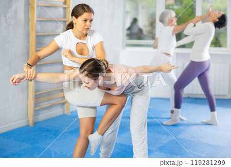 Two young women training self-defense techniques 119281299