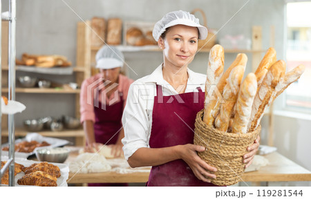 Portrait of positive woman bakery worker Portrait of positive woman bakery worker 119281544