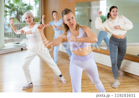 Group are practising arch movement in step jazz dance in fitness gym 119281631