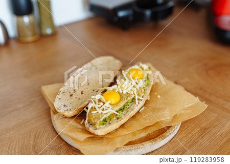 vegetable bruschetta with quail eggs, cheese in a home kitchen vegetable bruschetta with quail eggs, cheese in a home kitchen 119283958