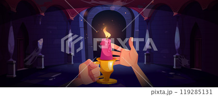 Burning candle in human hands in castle hall Burning candle in human hands in castle hall 119285131