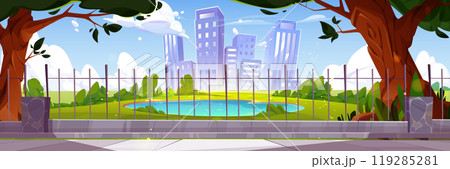 City park with lake and green trees behind fence 119285281