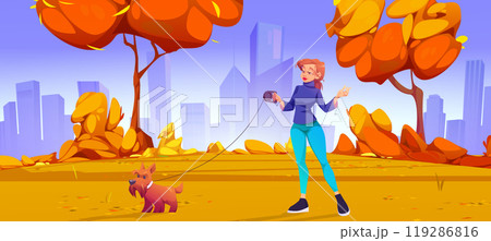 Young woman walking dog in autumn park 119286816