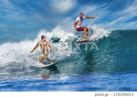 Two male surfers on a blue wave Two male surfers on a blue wave 119288023