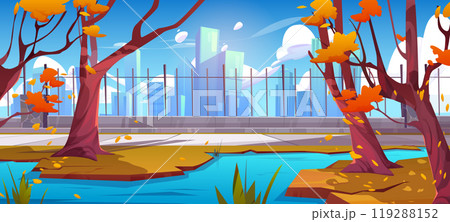 Autumn city park with pond and path near fence 119288152