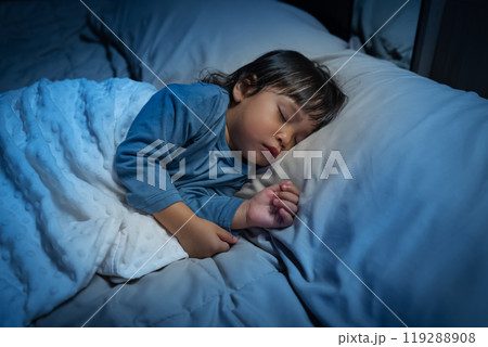 toddler baby sleeping on bed at night 119288908