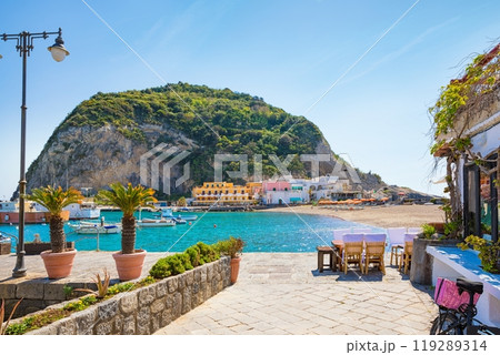 Beautiful coast of village Sant'Angelo, giant green rock in blue sea near Ischia Island, Italy. Beautiful coast of village Sant'Angelo, giant green rock in blue sea near Ischia Island, Italy. 119289314