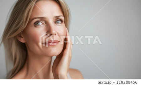 smooth-skinned woman in her 50s, isolated beauty portrait, rejuvenation and facial treatment smooth-skinned woman in her 50s, isolated beauty portrait, rejuvenation and facial treatment 119289456