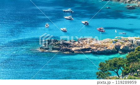 Marina Piccola with rocky shore and clear blue sea, Capri Island, Italy. 119289959