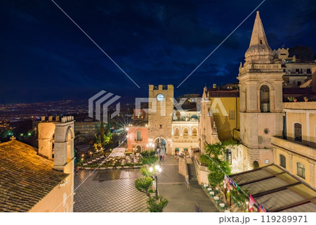 Night aerial view of Square Piazza IX Aprile with San Giuseppe church and Clock Tower in Taormina, Sicily, Italy. 119289971