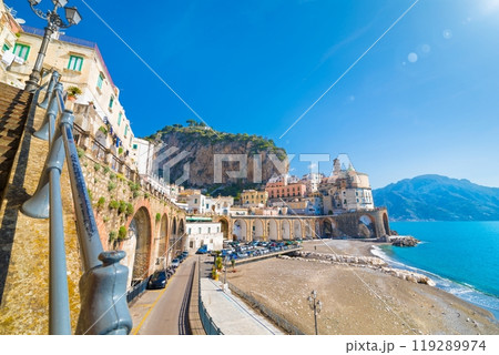Wide angle view of road leading along coast to small town Atrani in province of Salerno, Campania region, Italy. Wide angle view of road leading along coast to small town Atrani in province of Salerno, Campania region, Italy. 119289974