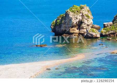 Big rock and narrow path connecting Isola Bella island to mainland Taormina beach, Sicily, Italy. Big rock and narrow path connecting Isola Bella island to mainland Taormina beach, Sicily, Italy. 119290154