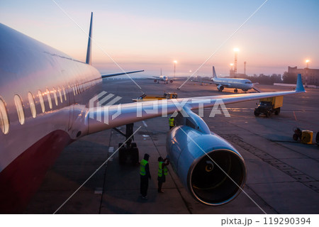 ground handling passenger airplane at the early morning airport 119290394