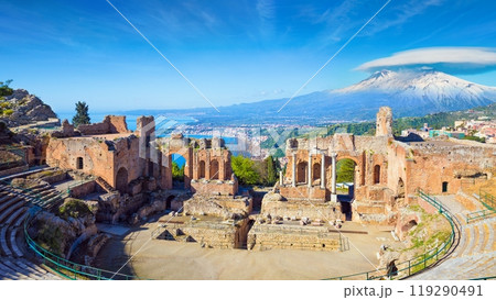 Morning view of ancient Greek theatre in Taormina on background of Etna Volcano, Sicily, Italy 119290491