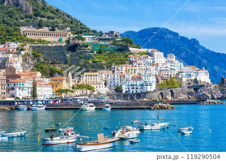 Beautiful Amalfi with hotels on hills leading down to coast, comfortable beaches and azure sea in Campania, Italy. 119290504