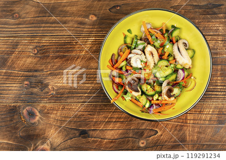 Spicy squid salad with mix vegetables. 119291234