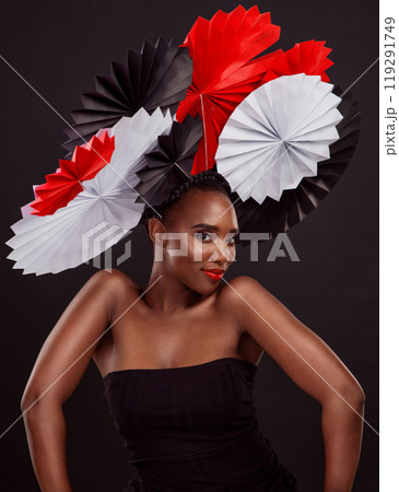 Portrait, African woman and smile with origami on hair in studio background for fashion, art and decor. Female person, designer and glamour for creativity, happy or design with pride or confidence 119291749