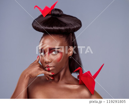 Beauty, makeup and origami with black woman in studio for creative, cosmetics and asian aesthetic. Traditional, paper design and model for heritage, art and confidence on gray background Beauty, makeup and origami with black woman in studio for creative, cosmetics and asian aesthetic. Traditional, paper design and model for heritage, art and confidence on gray background 119291805
