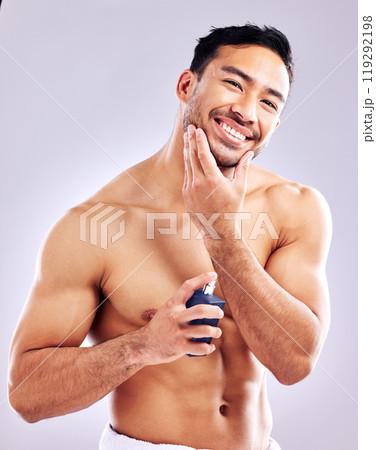 Man, smile and aftershave for face, beard and grooming for beauty and aesthetic wellness for healthy skin on studio background. Happy, guy and model for facial hair or dermatology, body and cosmetics Man, smile and aftershave for face, beard and grooming for beauty and aesthetic wellness for healthy skin on studio background. Happy, guy and model for facial hair or dermatology, body and cosmetics 119292198