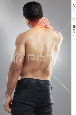 Studio, man and neck pain after fitness, muscle tension and injury from training as medical crisis. Back, male model and joint ache with inflammation, sports accident or bursitis by gray background Studio, man and neck pain after fitness, muscle tension and injury from training as medical crisis. Back, male model and joint ache with inflammation, sports accident or bursitis by gray background 119292252
