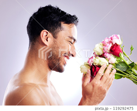 Man, flowers and studio with smile for wellness or health with care in confidence for roses. Hygiene, pride and natural for selfcare with creative in spring for valentines day or dermatology Man, flowers and studio with smile for wellness or health with care in confidence for roses. Hygiene, pride and natural for selfcare with creative in spring for valentines day or dermatology 119292475