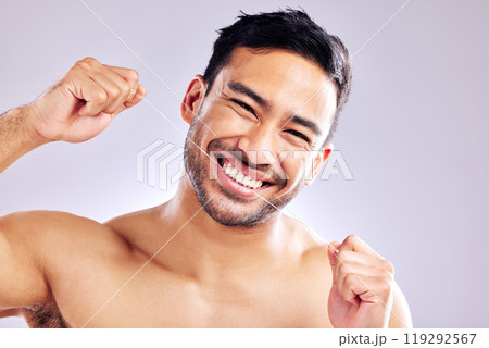 Oral health, portrait and man with flossing of teeth, wash and routine of hygiene in morning and dental. Studio, wellness and person with smile in white background, grooming and cleaning of tooth Oral health, portrait and man with flossing of teeth, wash and routine of hygiene in morning and dental. Studio, wellness and person with smile in white background, grooming and cleaning of tooth 119292567