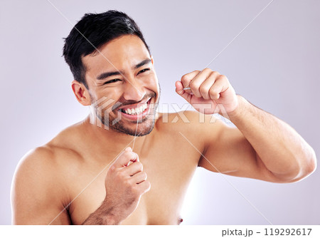 Cleaning, mouth and man with flossing of teeth, string and routine of hygiene in morning and dental. Studio, wellness and person with smile in white background, grooming and oral health of tooth Cleaning, mouth and man with flossing of teeth, string and routine of hygiene in morning and dental. Studio, wellness and person with smile in white background, grooming and oral health of tooth 119292617