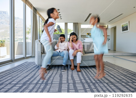 Parents, jump and stress in home, kids and tired with anxiety, burnout and noise in a living room. Mother, father and energetic children in a lounge, fatigue and depressed or motion and headache Parents, jump and stress in home, kids and tired with anxiety, burnout and noise in a living room. Mother, father and energetic children in a lounge, fatigue and depressed or motion and headache 119292635