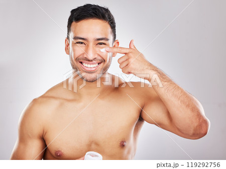 Face, portrait and man with lotion in studio for skin hydration, anti aging and collagen. Moisturizer, male model and skincare with cosmetics for smooth, glowing and soft texture by white background Face, portrait and man with lotion in studio for skin hydration, anti aging and collagen. Moisturizer, male model and skincare with cosmetics for smooth, glowing and soft texture by white background 119292756