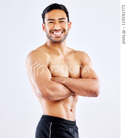 Happy asian man, portrait and muscular body with confidence for workout routine on a white studio background. Male person or bodybuilder with smile or arms crossed in fitness, exercise or weight loss Happy asian man, portrait and muscular body with confidence for workout routine on a white studio background. Male person or bodybuilder with smile or arms crossed in fitness, exercise or weight loss 119292773