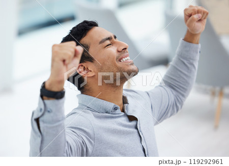 Fist, motivation and winner with business man in office for celebration of achievement, bonus or promotion. Goals, success and target with happy employee cheering for deal in agency workplace Fist, motivation and winner with business man in office for celebration of achievement, bonus or promotion. Goals, success and target with happy employee cheering for deal in agency workplace 119292961