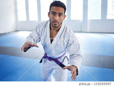 Man, portrait or fighting for martial arts sport in fitness center for self defense, ready or discipline. Athlete, pov and serious with uniform for training, practice or wellness for competition Man, portrait or fighting for martial arts sport in fitness center for self defense, ready or discipline. Athlete, pov and serious with uniform for training, practice or wellness for competition 119293097