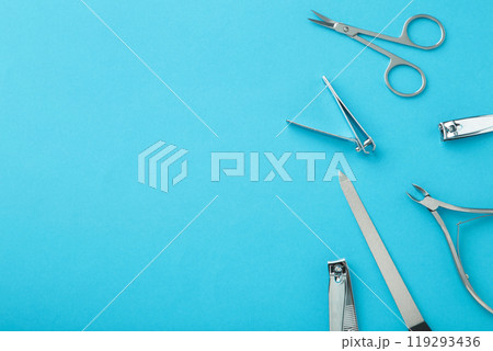 Tools of a manicure set on blue background with copy space. 119293436