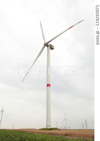 Windmills for electric power production on a cloudy day 119293871