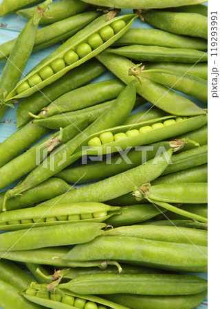Green pea background. Pea pods from farmland. Pea freshly picked. Organic fresh vegetables. Healthy eating. 119293991