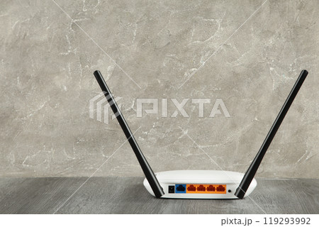 Wireless Wi-Fi router on grey background with copy space 119293992